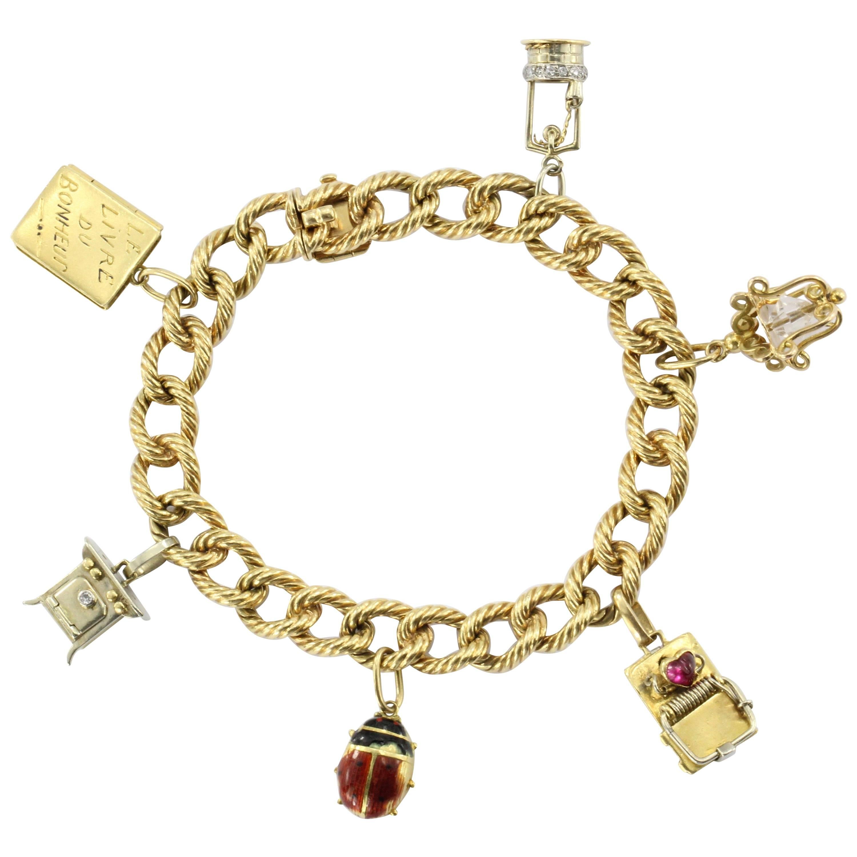 Cartier 18 Karat Gold French Retro Loaded Charm Bracelet, circa 1950s