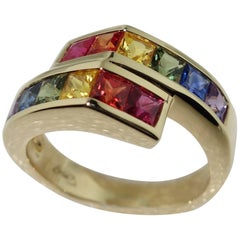 Bague croisée en or et saphirs multicolores taille princesse de 2,42 carats