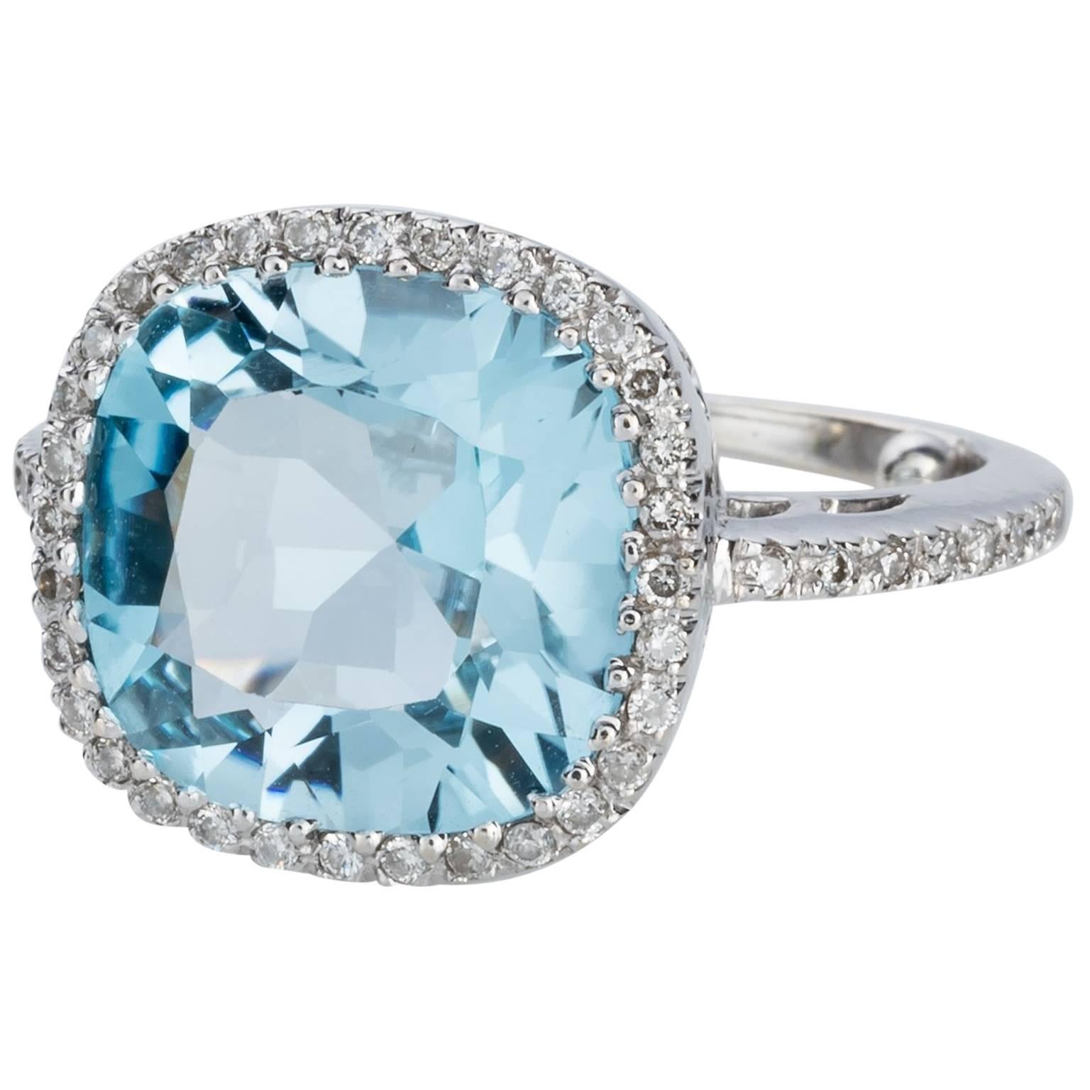 Blue Topaz and Diamond 18 carat White Gold Halo Style Dress Ring
