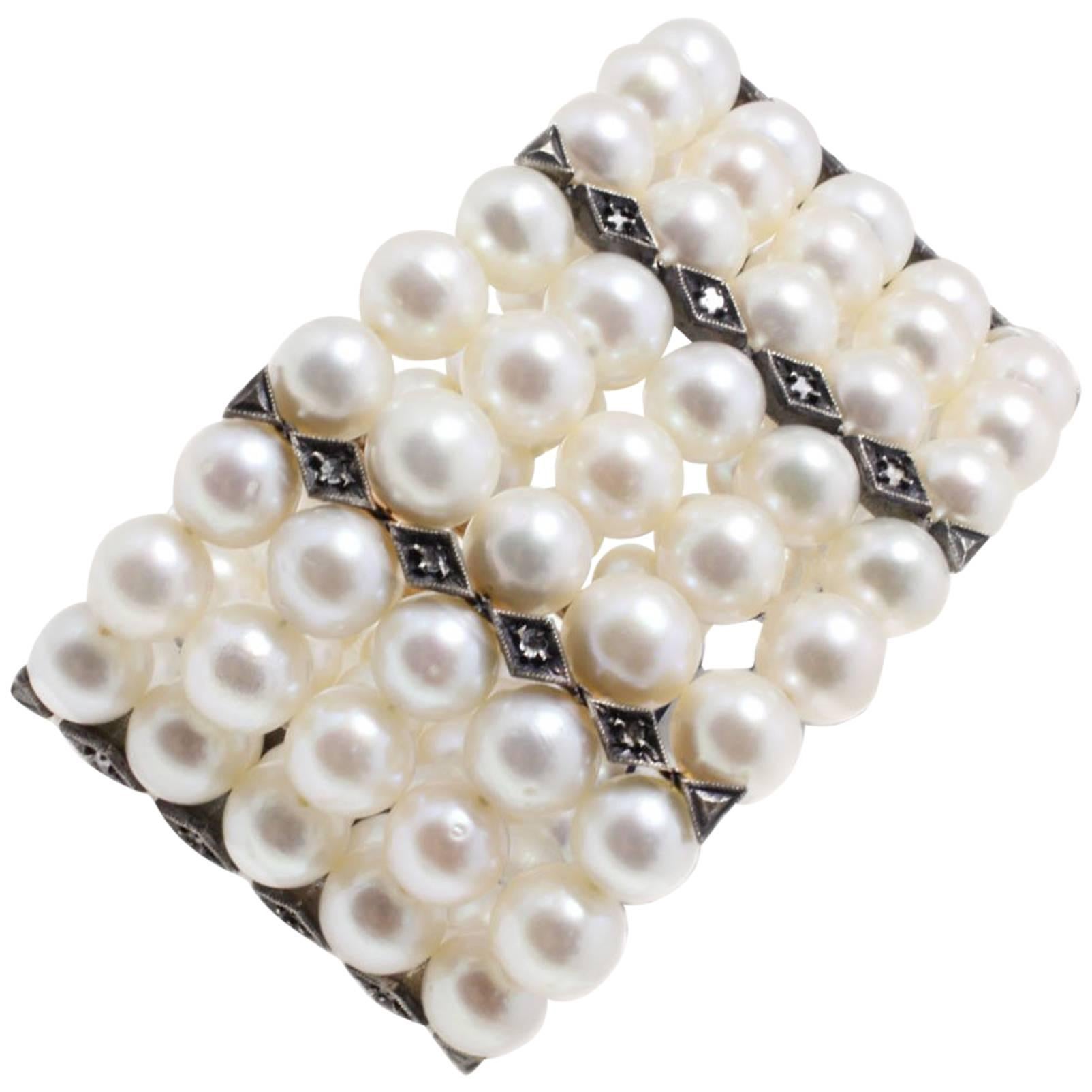 Bracelet perles blanches de 77,20 g, diamants de 0,30 carat, or rose et argent