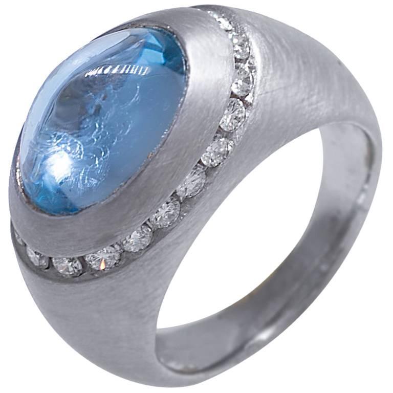 Dome Ring with Blue Topaz Cabochon and Diamonds For Sale