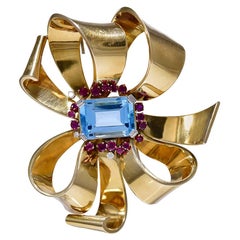 Retro Ruby Diamond Topaz 18 Karat Gold Ribbon Brooch, circa 1950