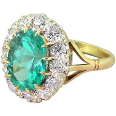 Vintage Midcentury 3.26 Carat Colombian Emerald and Diamond Cluster Ring, circa 1950