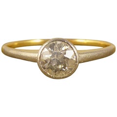 1930s Diamond Solitaire Engagement Ring modeled in 18 Carat Gold and Platinum