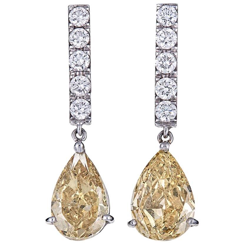 GIA Certified 4.04 Carat Pear Yellow Diamond White Gold Drop Earrings For Sale