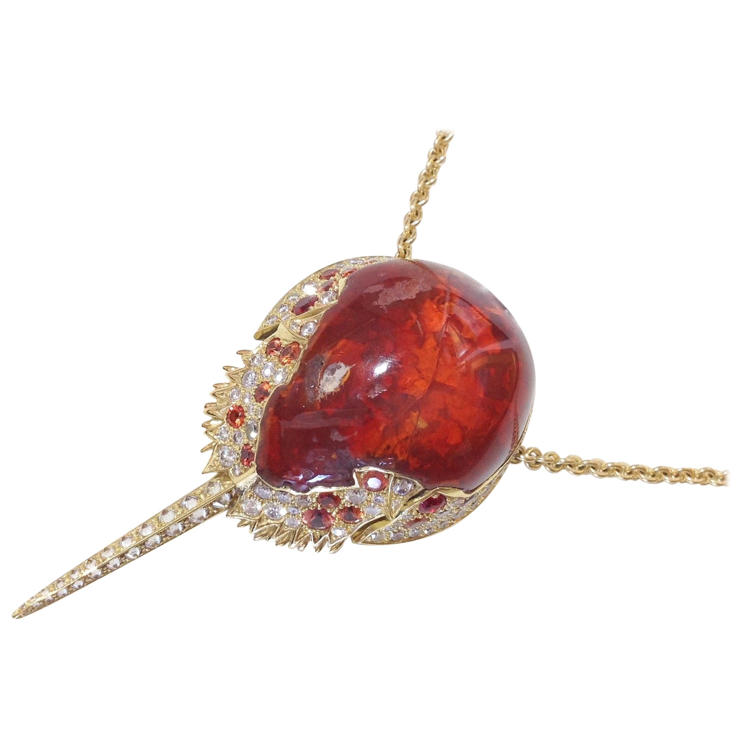 Inspired by the shape of the Mexican Fire Opal, the horseshoe crab necklace was designed using 1.81ct Orange Sapphires and 2.135ct Diamonds. Boasting strength and graceful antiquity, this one-of-a-kind pendant elegantly hangs from a 28 inch 18kt