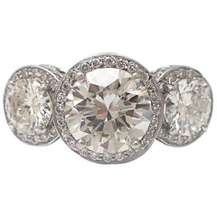 GIA Certified 2.88 Carat Round Diamond Platinum Three-Stone Ring