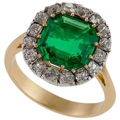 Edwardian Emerald Diamond Gold and Platinum Cluster Ring