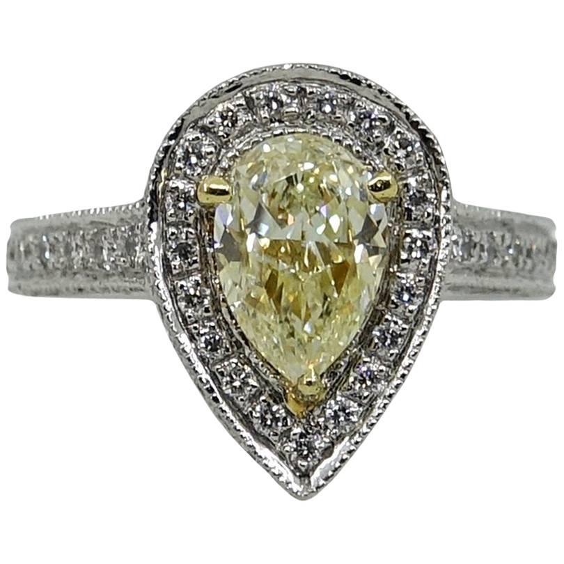 1.33 Pear Shaped Fancy Light Yellow Diamond Platinum Engagement Ring For Sale