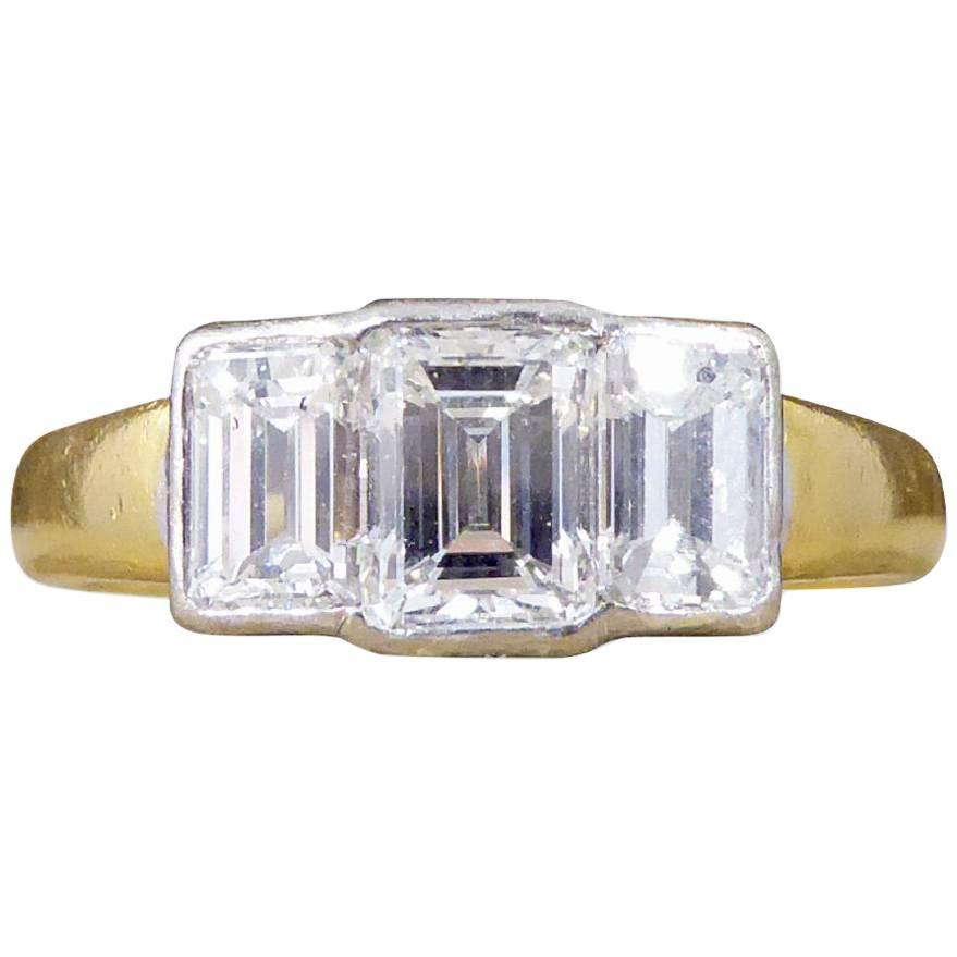 Modern Emerald Cut Diamond Three-Stone Engagement Ring in 18 Carat Gold