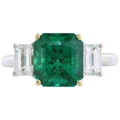 GIA Certified 3.31 Carat Emerald Diamond Three-Stone Ring