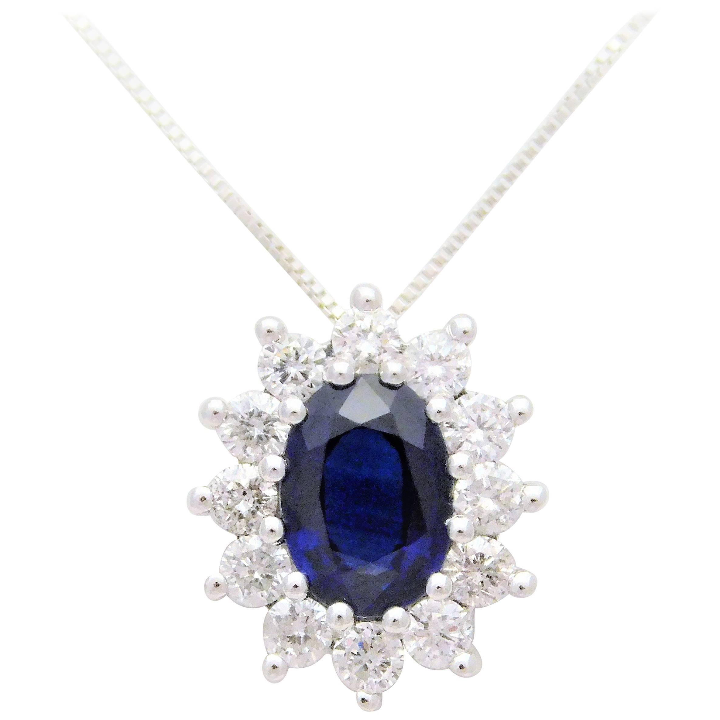 14 Karat White Gold Natural Deep Blue Sapphire and Diamond Halo Pendant Necklace