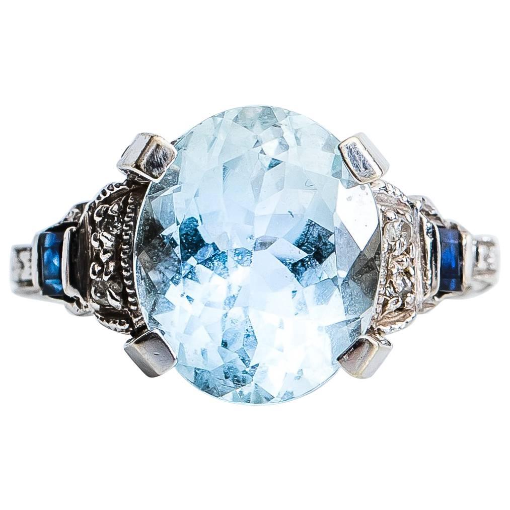 1950s 3 Carat Oval Aquamarine, Diamond and Sapphire 14 Karat Gold Ring
