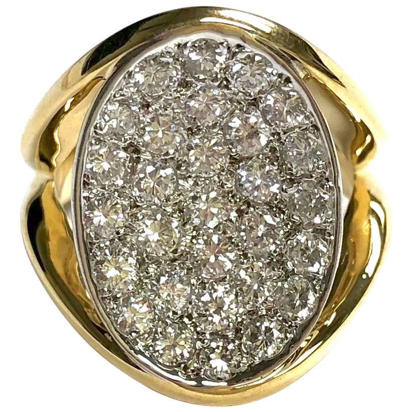 Crafted in 18K gold, featuring an 18x14m pave' diamond set disc supported by split shoulders, completed by a two millimeter wide band.
Approximate total diamond weight: 1.80ct., Color: F-G, Clarity: VS-SI
Weight: 9.8 grams
Size: 6 (Sizable)