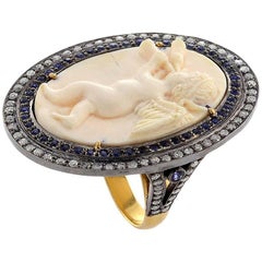 Cameo Cupid Ring Diamonds and Blue Sapphire