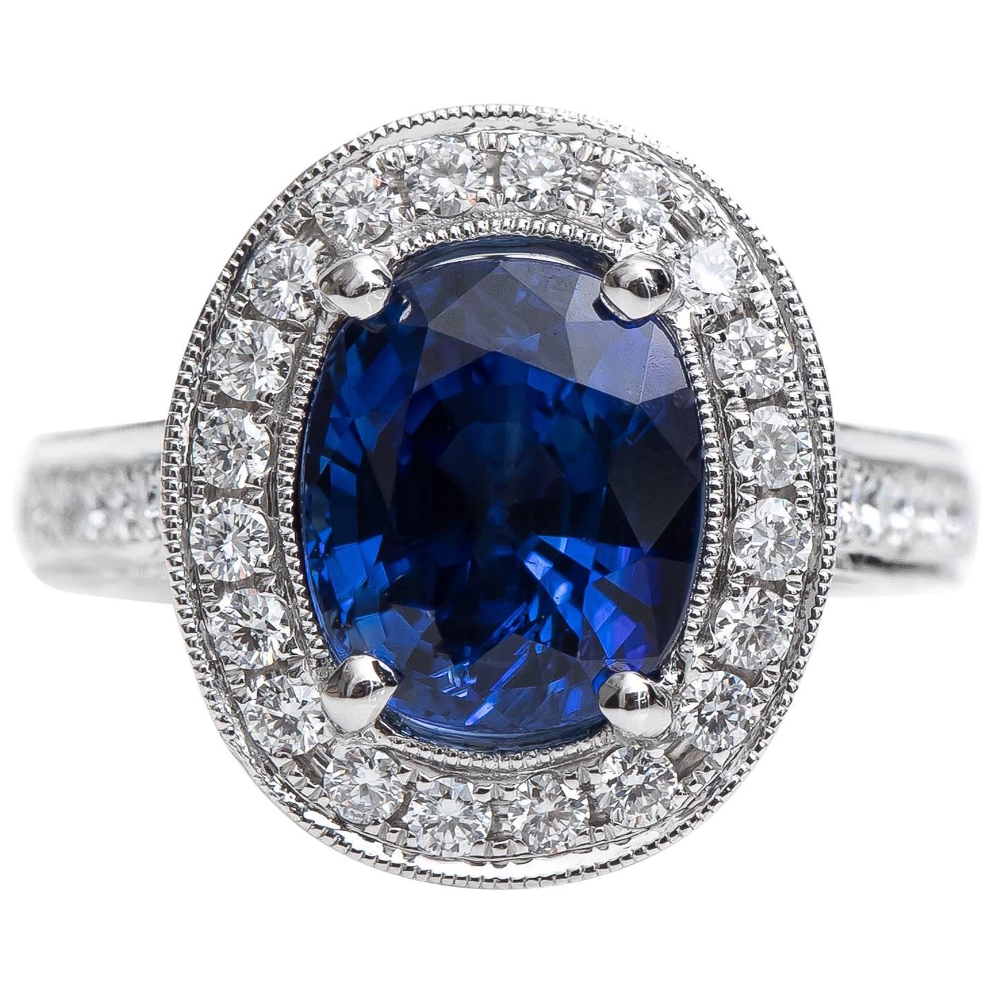 GIA Certified 3.75 Carat Cushion Oval Sapphire and Diamond Halo Ring For Sale