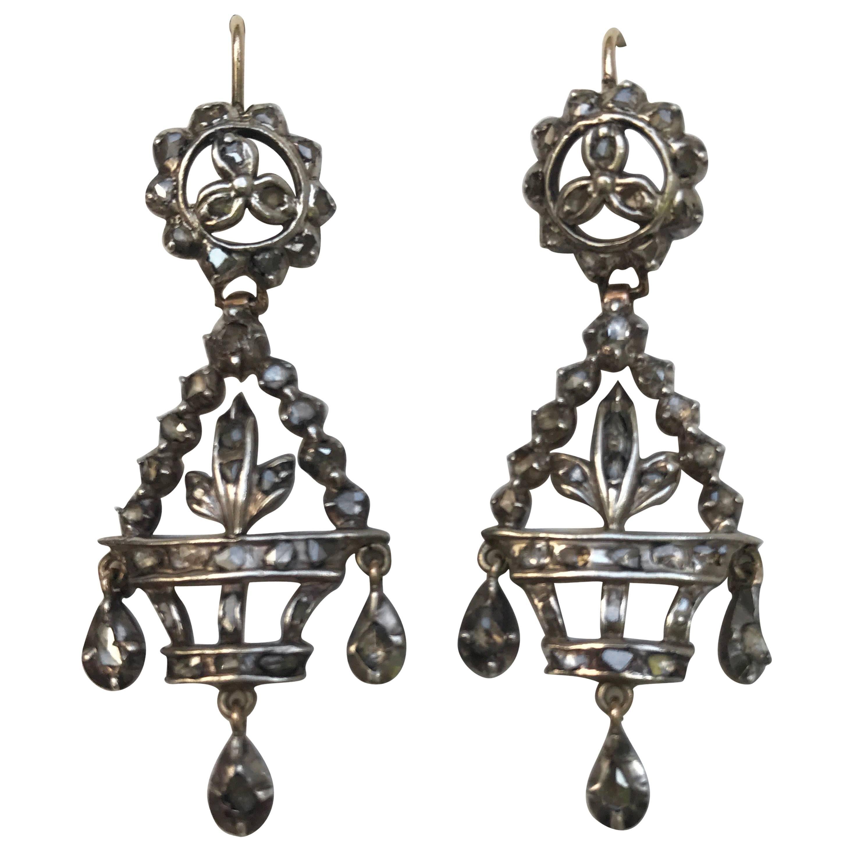 A pair of antique Giardinetti urn shaped earrings, set in a pinched silver setting, typical of the period, with gold hooks to the back and then backed in gold too. Very elegant earrings the front is silver set and the back is set in gold with 9k