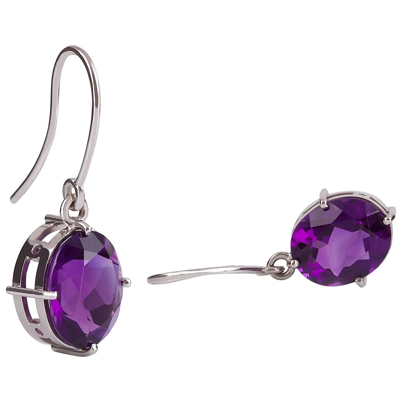 Viola Earrings

This beautiful pair of handmade earrings in 18ct white gold feature two striking amethysts set in four prong settings and suspended from elegant shepherd hooks

2 x Oval faceted amethysts: Deep purple colour, measuring 12 x 9.6 x 6mm
