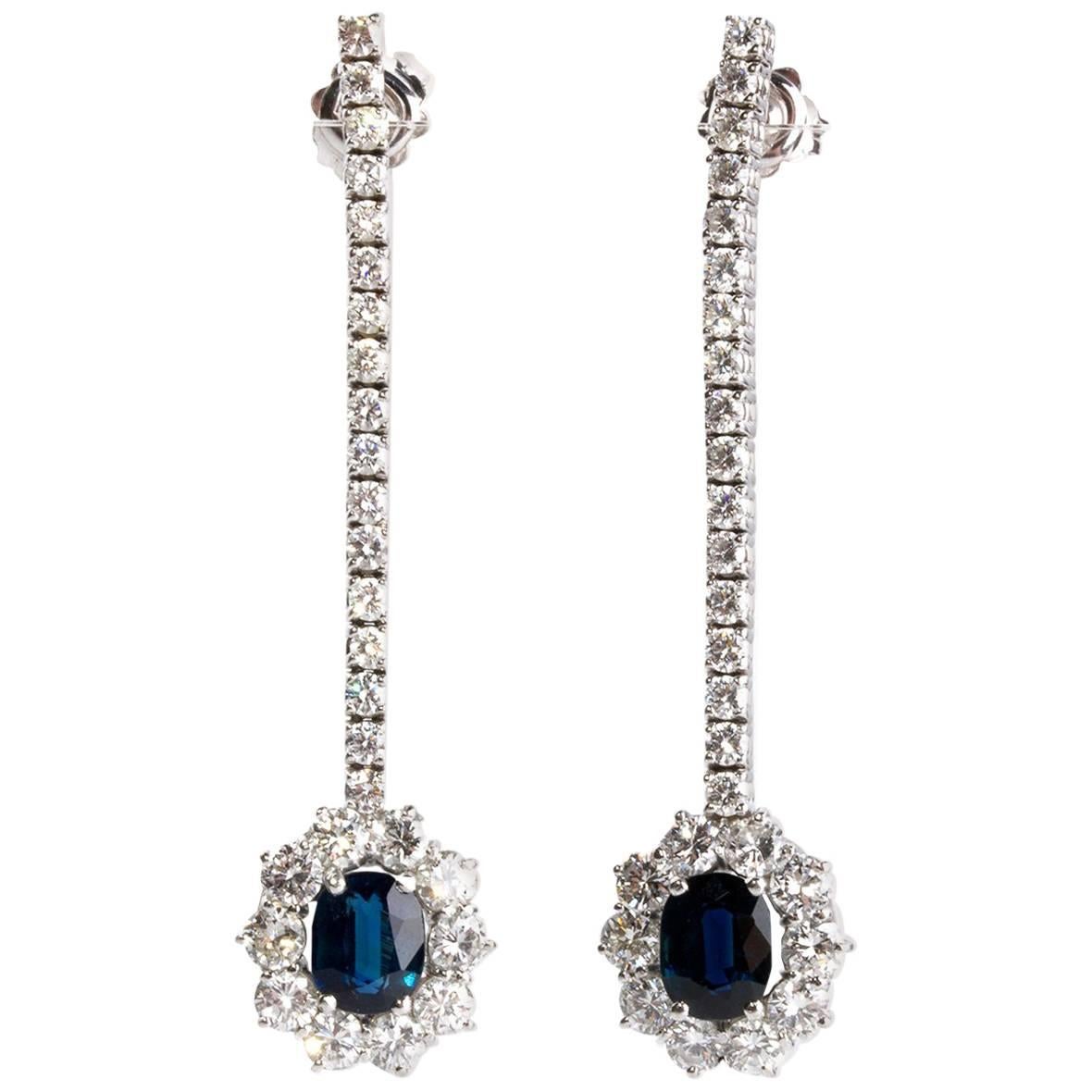 Pair of Blue Sapphire Diamond Halo Gold Earrings For Sale