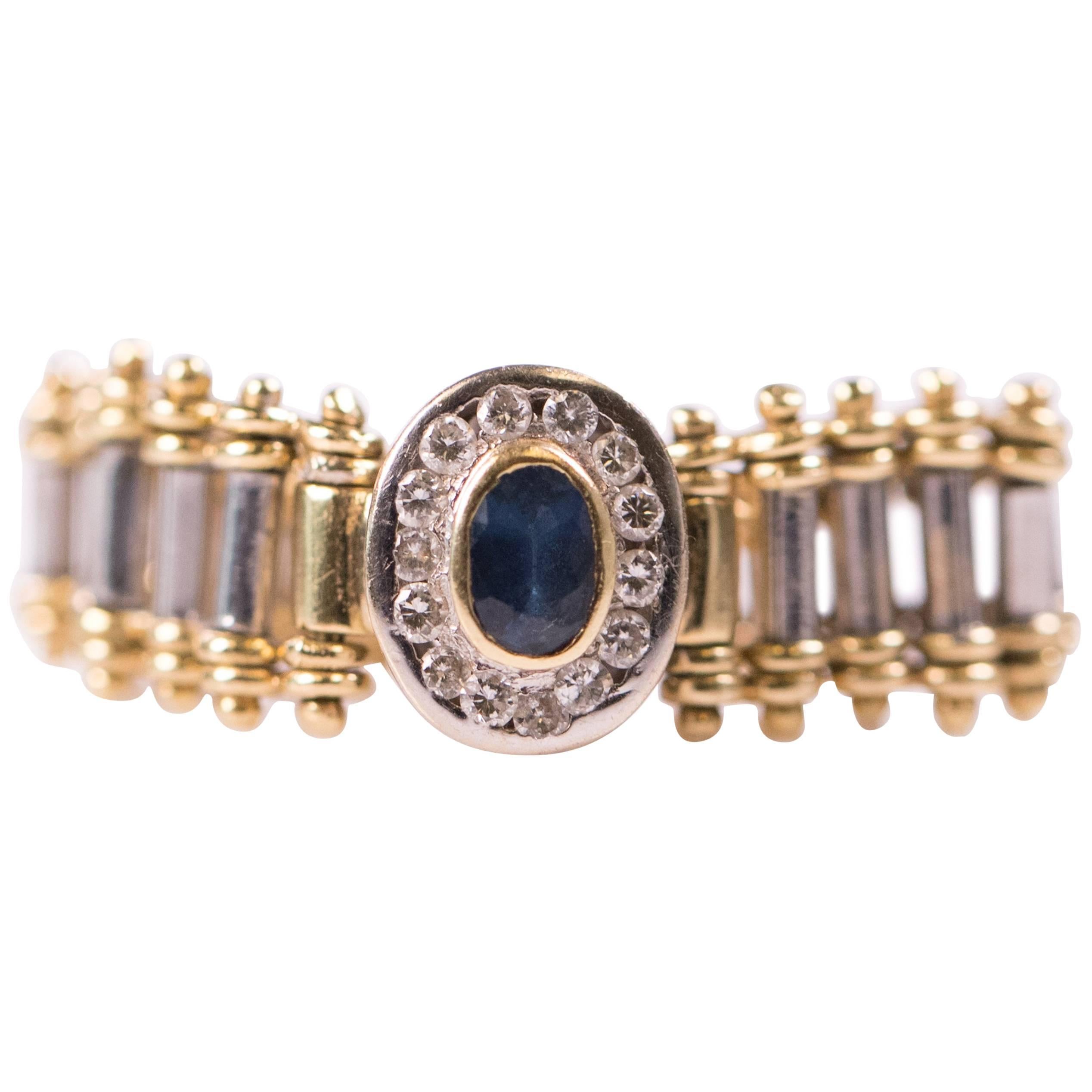 1980s Oval Sapphire and Diamond Halo 18 Karat Gold Flex Ring For Sale