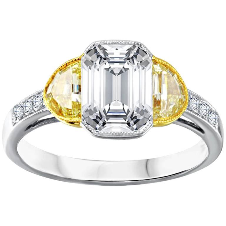 Platinum 2.00 Carat Emerald Cut Engagement Ring with Two Half Moon Diamonds For Sale