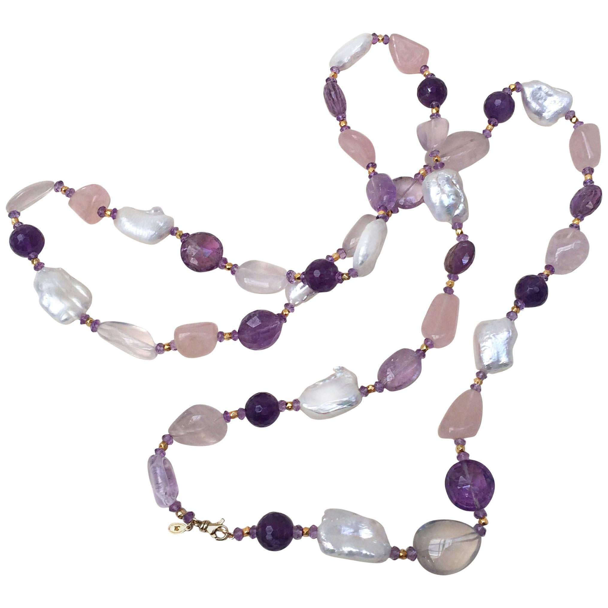 The rose quartz, amethyst, pearl, and vermeil gold beads give this necklace with tassel great contrasting light and dark tones. The contrasting tone is highlighted by the different shapes and textures of the beads. A 14k yellow gold clasp secures