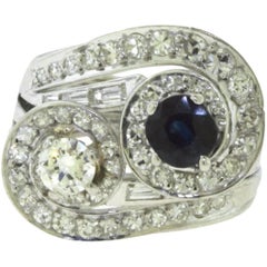 Diamond and Sapphire Center Stone Diamond White Gold Swirl Ring