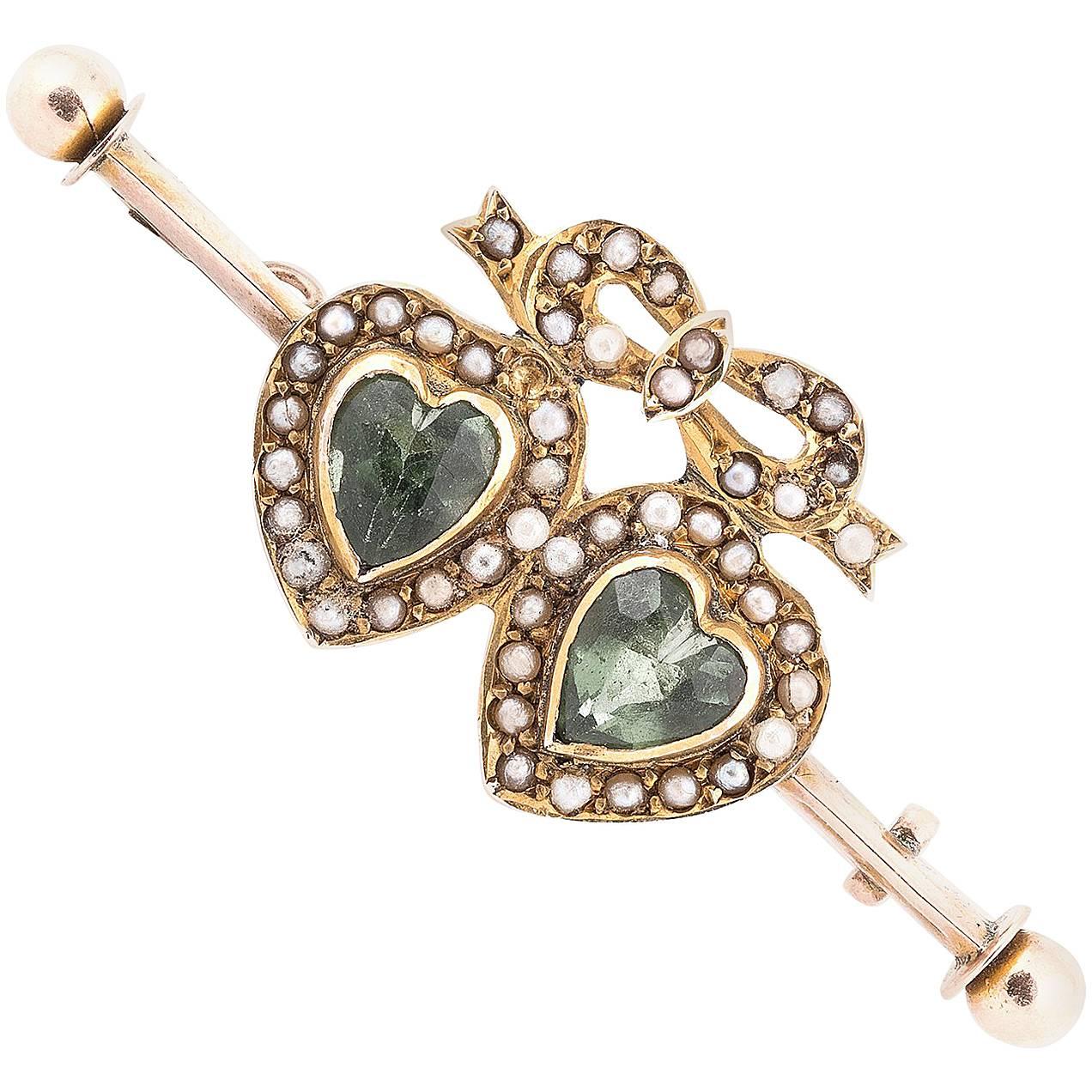 Late Victorian Gold Dress Pin with Two Heart Peridot Stones For Sale