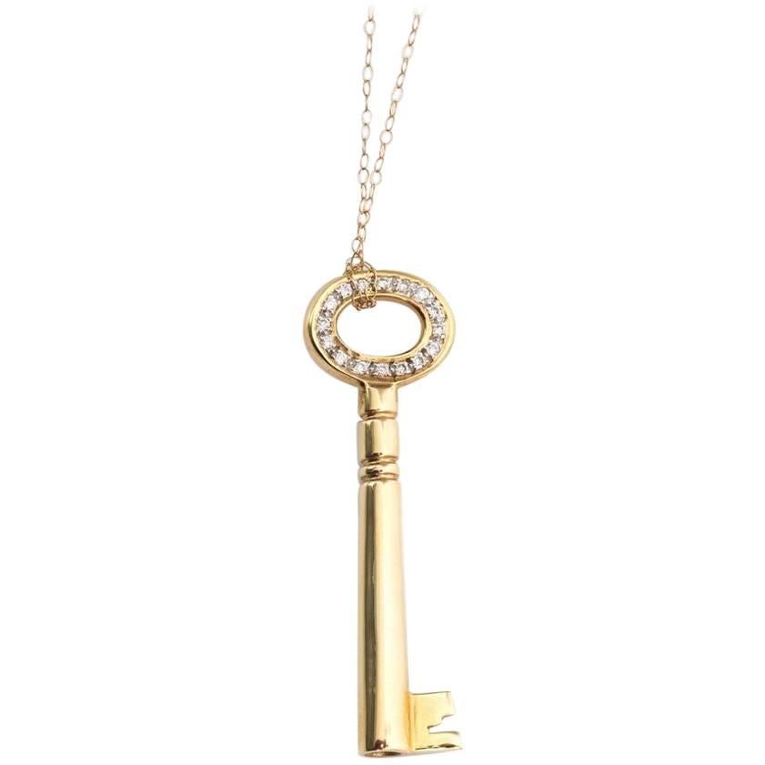 Diamond and 14 Karat Yellow Gold Key Pendant Necklace For Sale