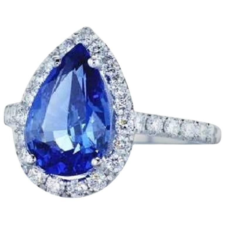 Handcrafted 3.53 Carat pear shape blue sapphire ring surrounded by  31 high quality diamonds, 0.60 Carat Total Weight and mounted on 18K white gold
Ring Details: 
GRS Certified 
3.53 Carat Pear Shape Blue Sapphire
31 round diamonds, 0.60 Carat total