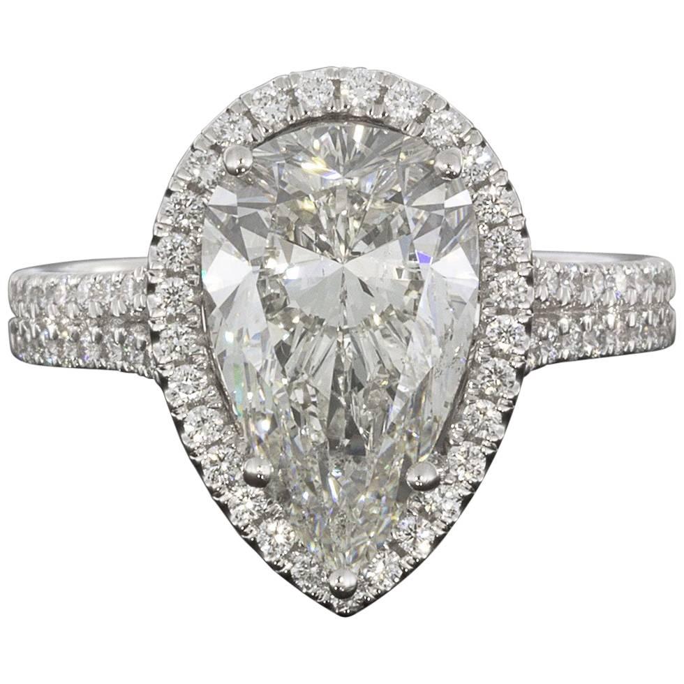 3.96 Carat Platinum Certified Pear Diamond Halo Engagement Ring For Sale