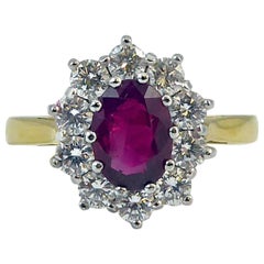 1.04 Carat Ruby and 0.80 Carat Diamond Cluster Ring, 18 Carat Gold, London, 2009