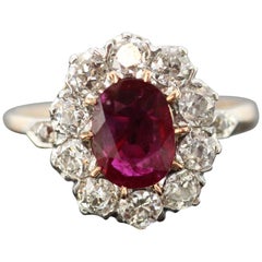 18 Karat Yellow Gold Oval Ruby Diamond Cluster Ring, circa 1970s