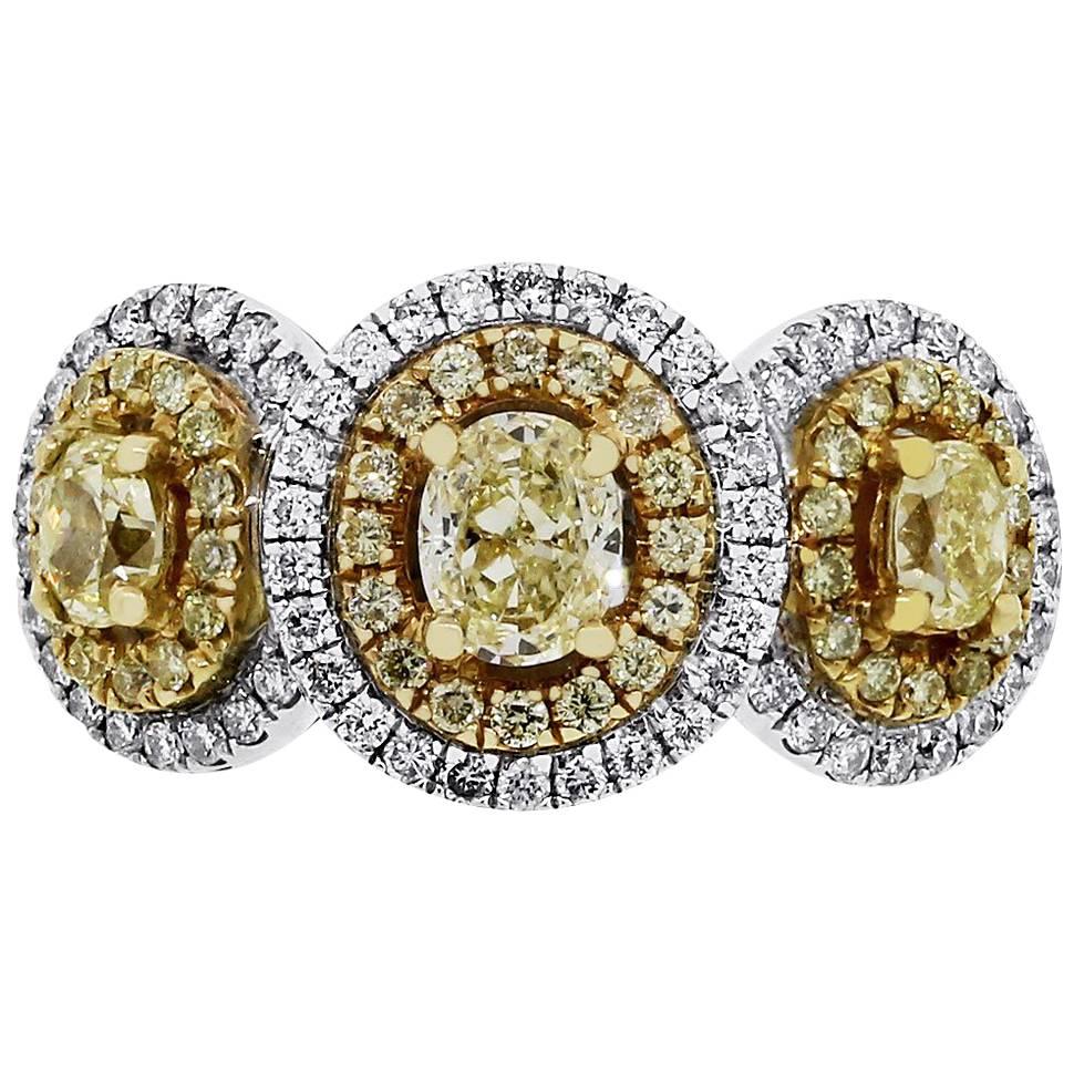 Fancy Yellow and White Diamond Three-Stone Halo Ring