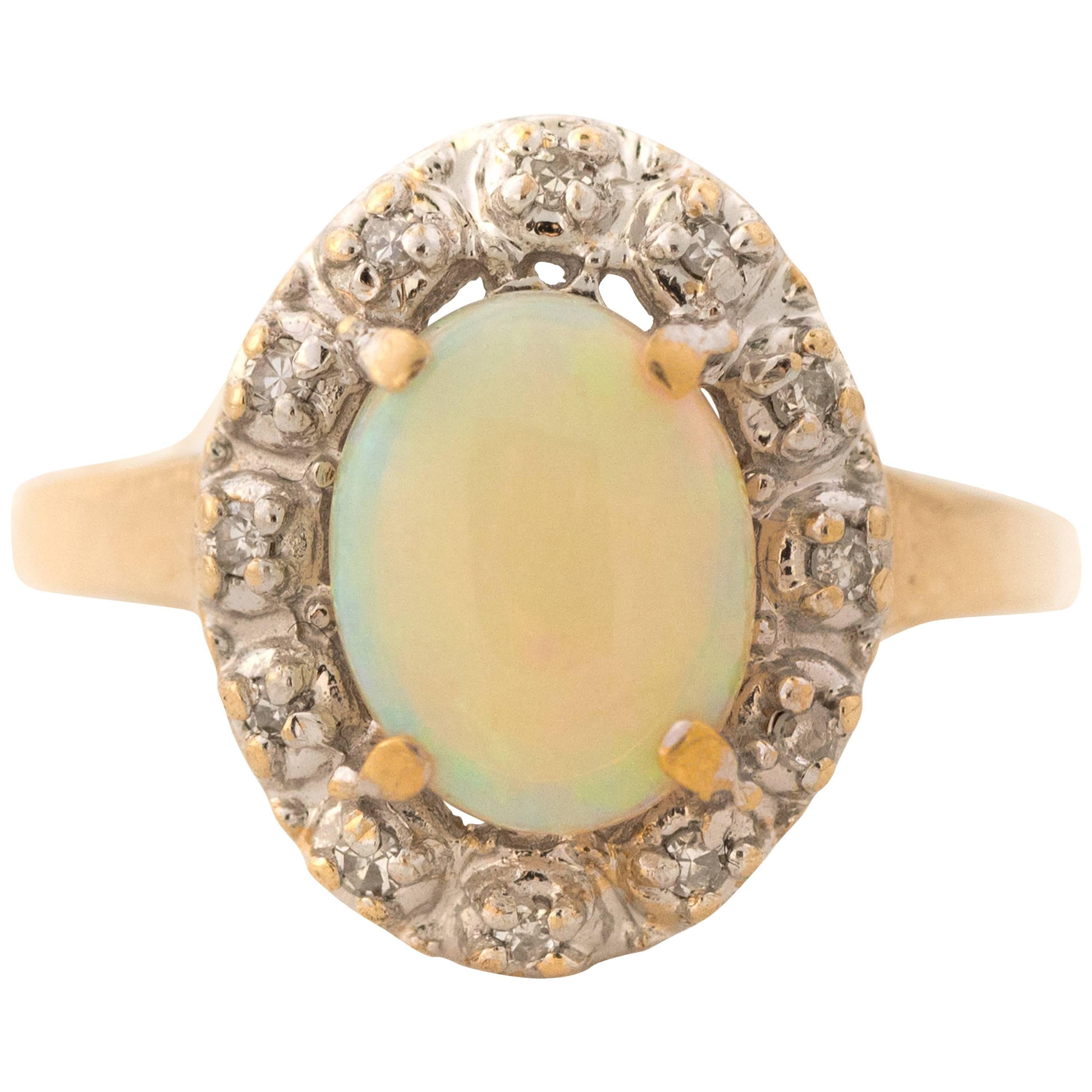 1960s Opal and Diamond Halo 14 Karat Yellow Gold Ring