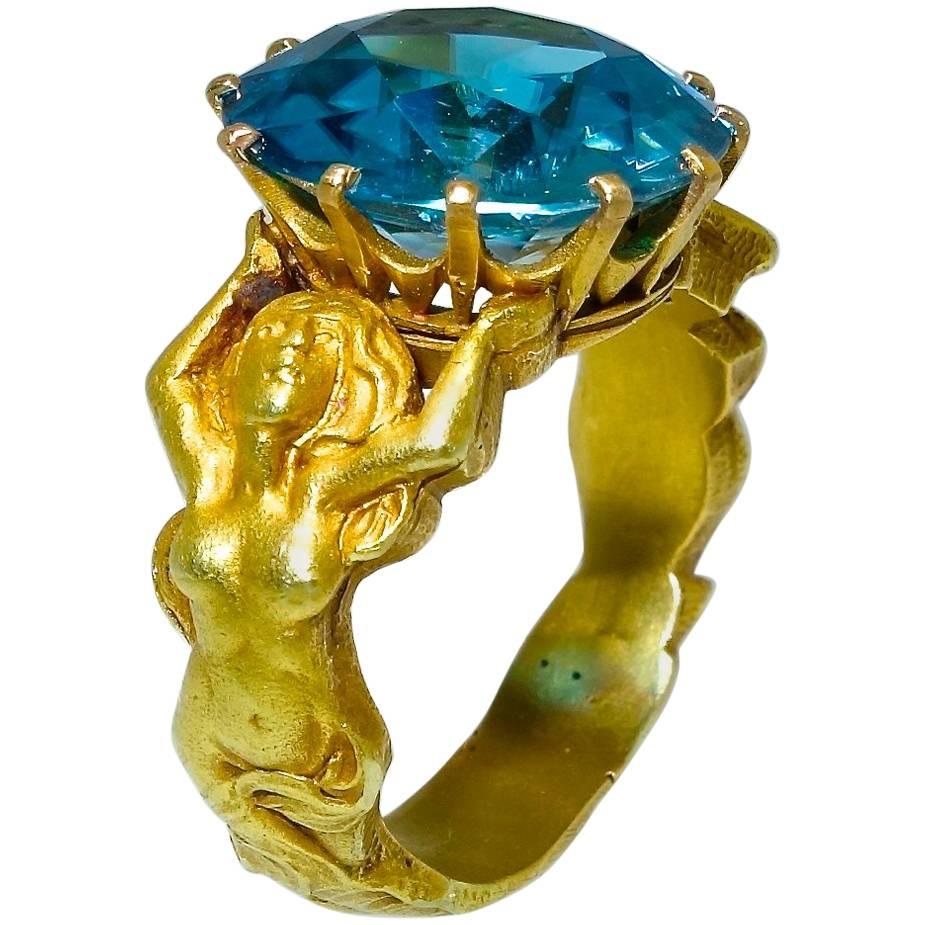 Highly Sculpted Art Nouveau Mermaid Ring centering a Very Fne Zircon