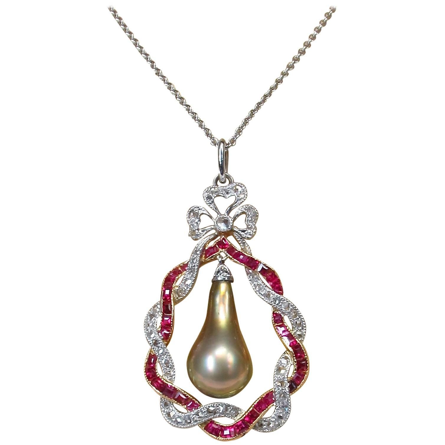 Edwardian Bronze Natural Pearl Drop Rubies Diamonds Pendant