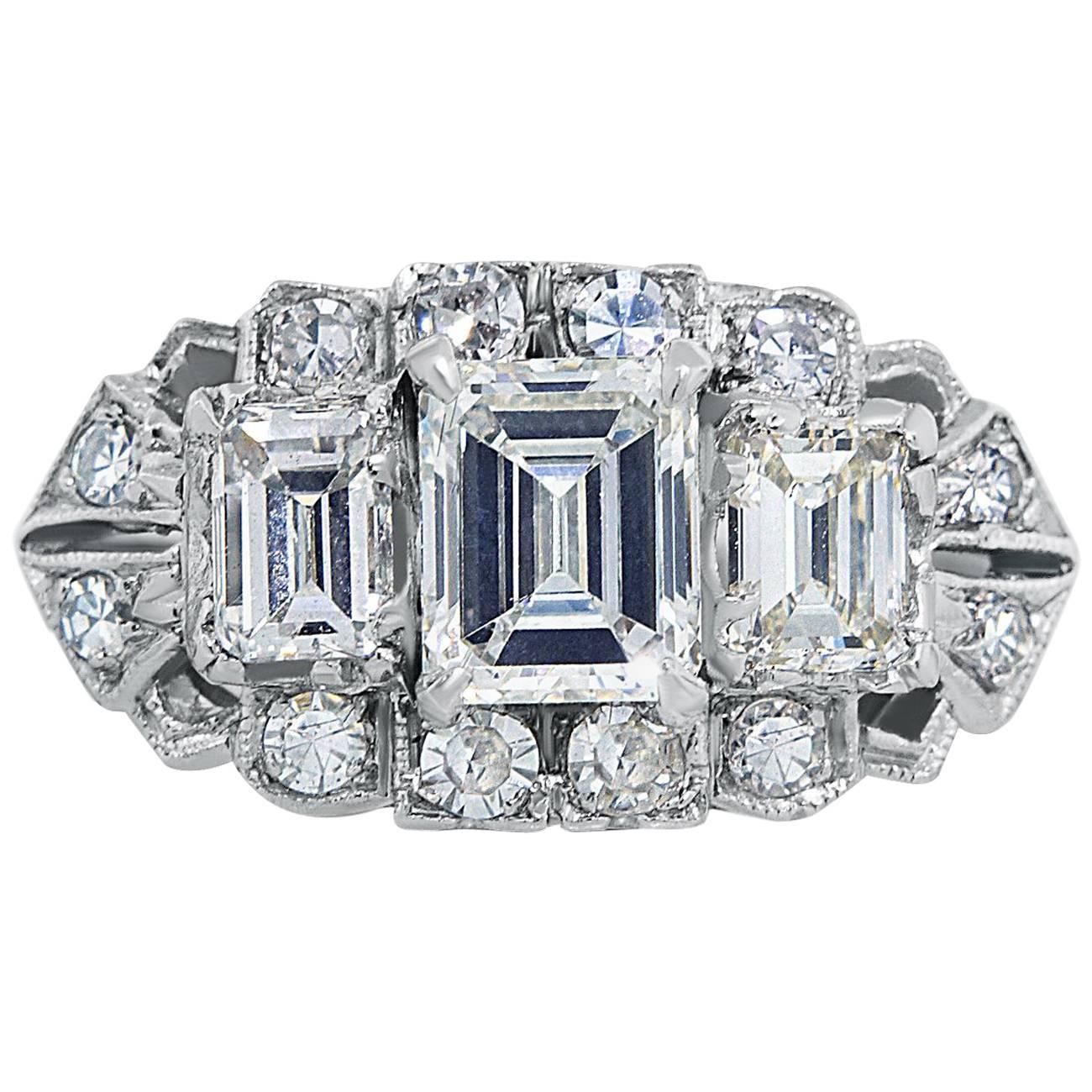 Art Deco Platinum Three Emerald Cut Diamond and Twelve Single Cut Diamond Ring For Sale