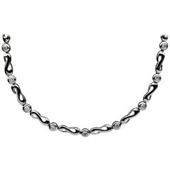 14 Karat White Gold 0.36 Carat 9 Round Diamond Infinity Link Necklace
