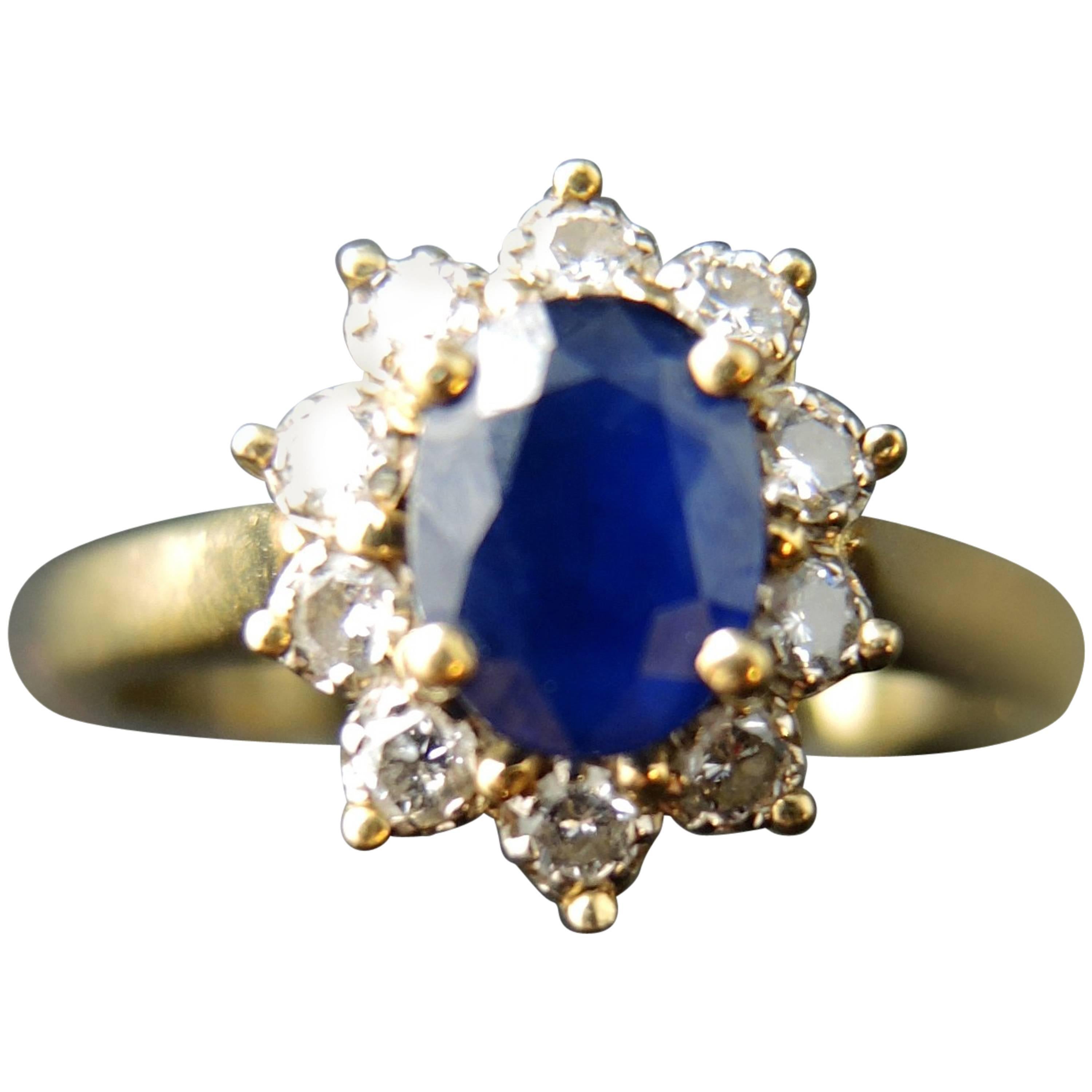 French Vintage Gold Cluster Ring with a Sapphire Surrounded by Diamonds