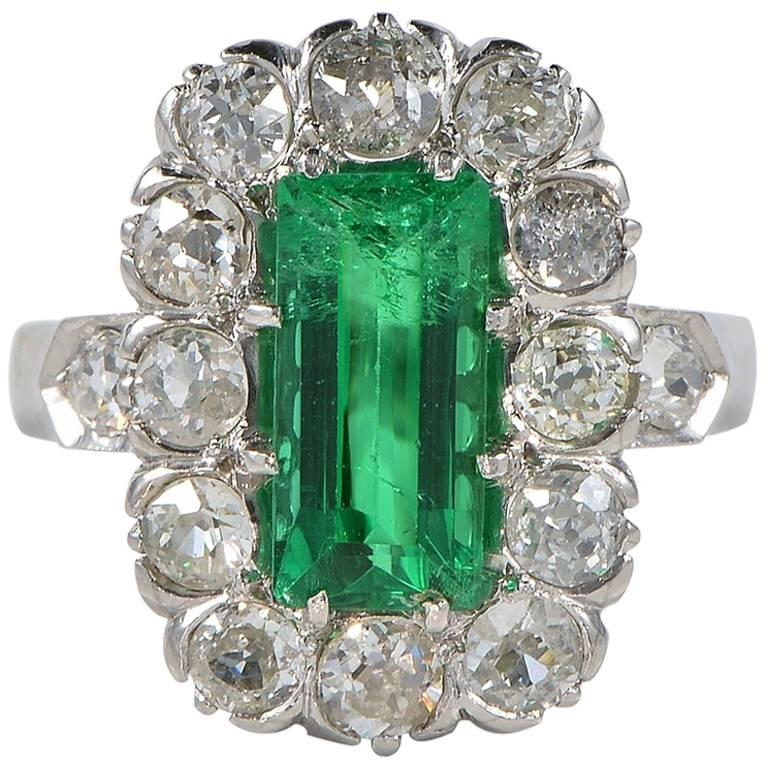 Vintage 1.60 Carat Colombian Emerald 2.20 Carat Mine Cut Diamond Platinum Ring