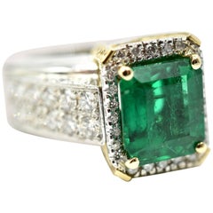 Ladies 3.89ct Emerald with 1.61cttw Diamonds Platinum 
18k Yellow Gold Ring