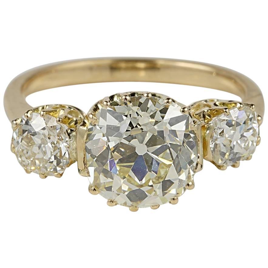 Edwardian 4.22 Carat Old Mine Cushion Diamond K/L VVS1 Trilogy Ring For Sale