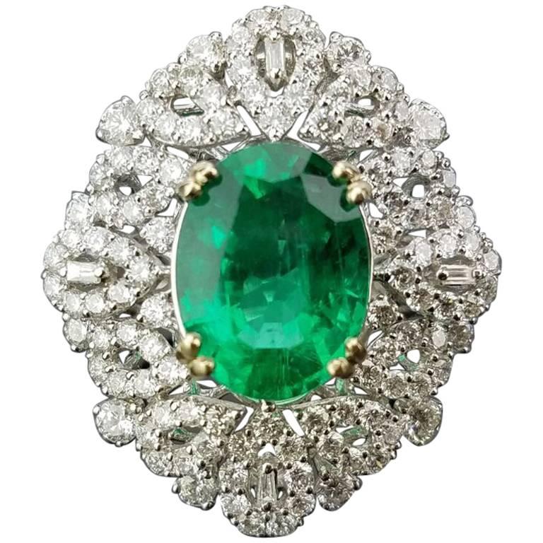 Certified Insignificant Oil 4.95 Carat Oval Emerald and Diamond Cocktail Ring