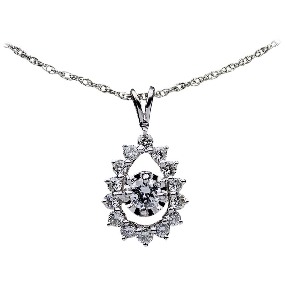 14 Karat White Gold .75 Carat Round Diamond Pear Shaped Halo Pendant Necklace For Sale
