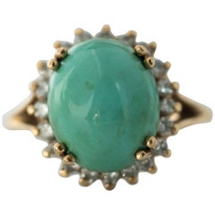 1950s Tiffany & Co. Persian Turquoise Cabochon Diamond Halo 14 Karat Gold Ring