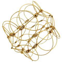 Bracelet jonc ajouré en or jaune avec diamants