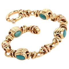 1980s Turquoise Cabochon Yellow Gold Barrel Motif Link Bracelet