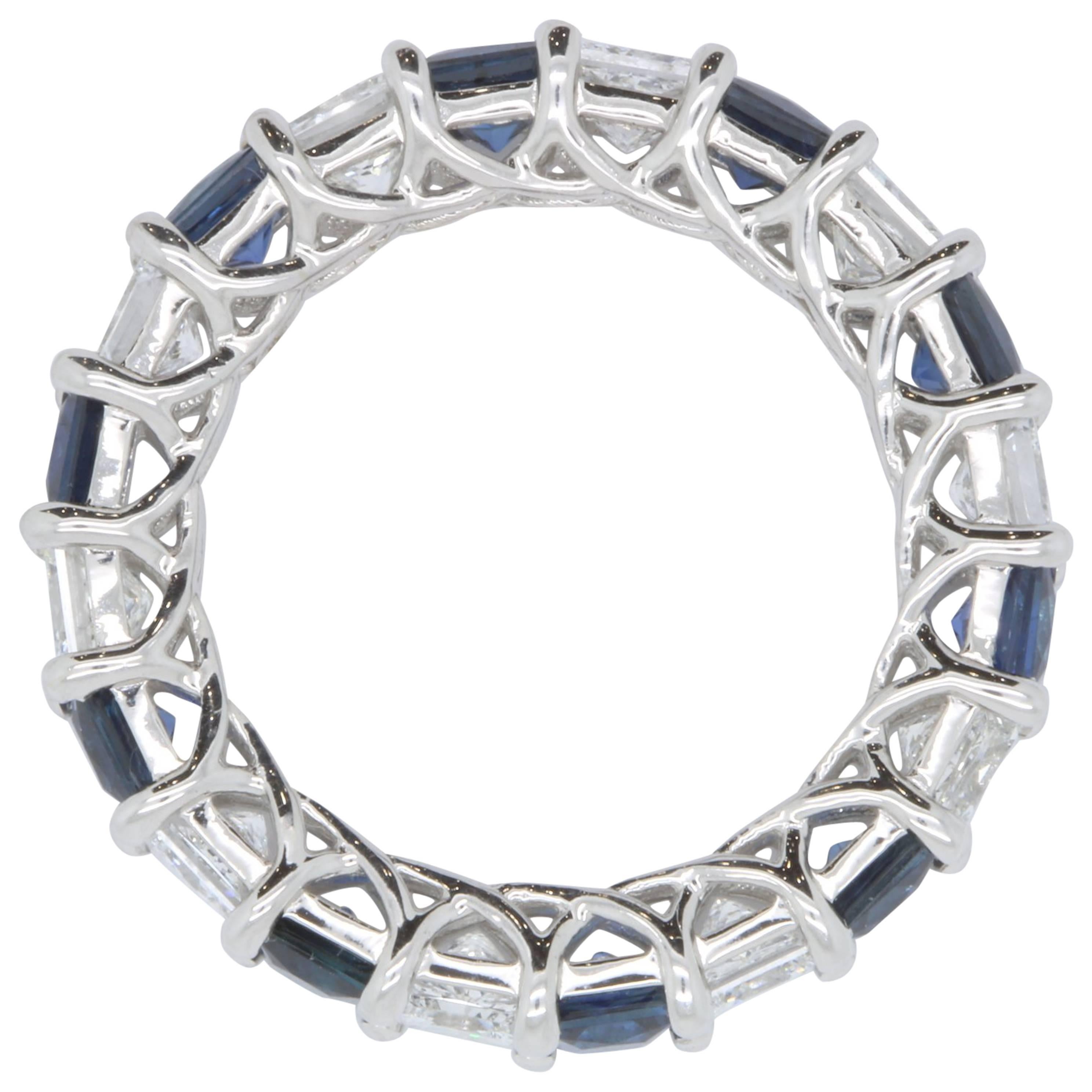 Material: 18k White Gold
Gemstone: 10 Princess Cut Blue Sapphires at 2.73 Carats 
Diamond:  10 Princess Cut Diamonds at 2.34 Carats - VS Clarity / G-H Color
Ring Size: Size 5.5 - This ring can be remade in your size. Price may vary depending on