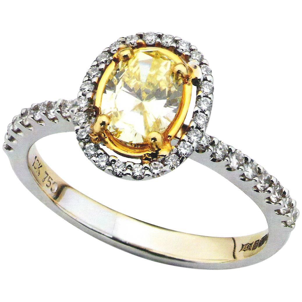 Yellow Oval Diamond 18 Carat White Gold Halo Engagement Ring For Sale